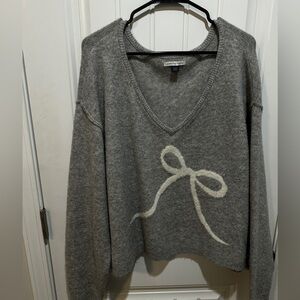American Eagle Outfitters Gray V-Neck Sweater with Cream Bow